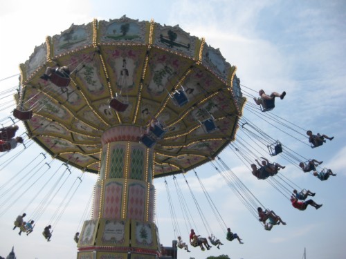 People Riding Flying Fiesta Theme Park Ride Amusement Park - riding a horse coaster on roblox theme park tycoon 2 4